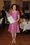 Jenni Haukio oli pukeutunut kauniisti hohtavaan pinkkiin leninkiin.