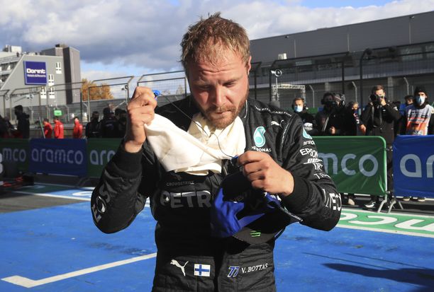 epa08734254 Finnish Formula One driver Valtteri Bottas of Mercedes-AMG Petronas reacts after he took pole position during the qualifying session of the Formula One Eifel Grand Prix at the Nuerburgring race track in Nuerburg, Germany, 10 October 2020. The Formula One Eifel Grand Prix will take place on 11 October 2020.  EPA-EFE/Wolfgang Rattay / Pool