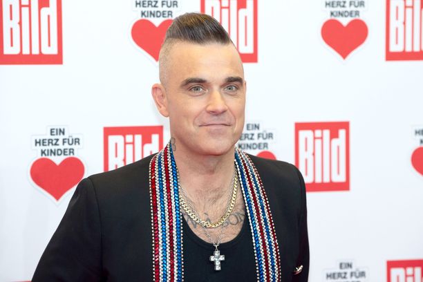 Robbie Williamsin koko perhe on jumissa Karibialla.