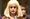 Hathaway nähdään blondissa peruukissa kasvot ruhjeilla.