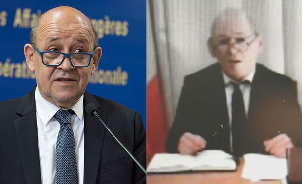 Vasemmalla oikea Jean-Yves Le Drian, oikealla ministerinä esiintyvä mies kuminaamarissa.