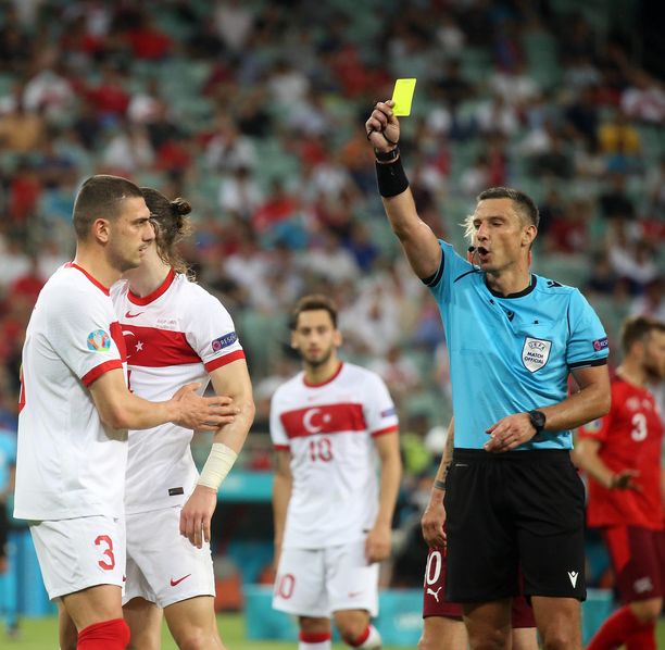  Referee Slavko Vincic show yellow card to Caglar Soguncu 4 of Turkey during the EURO 2020 Group A match between Turkey and Switzerland at Olympic Stadium in Baku , Azerbaijan , on 20 June , 2021. PUBLICATIONxNOTxINxTUR
